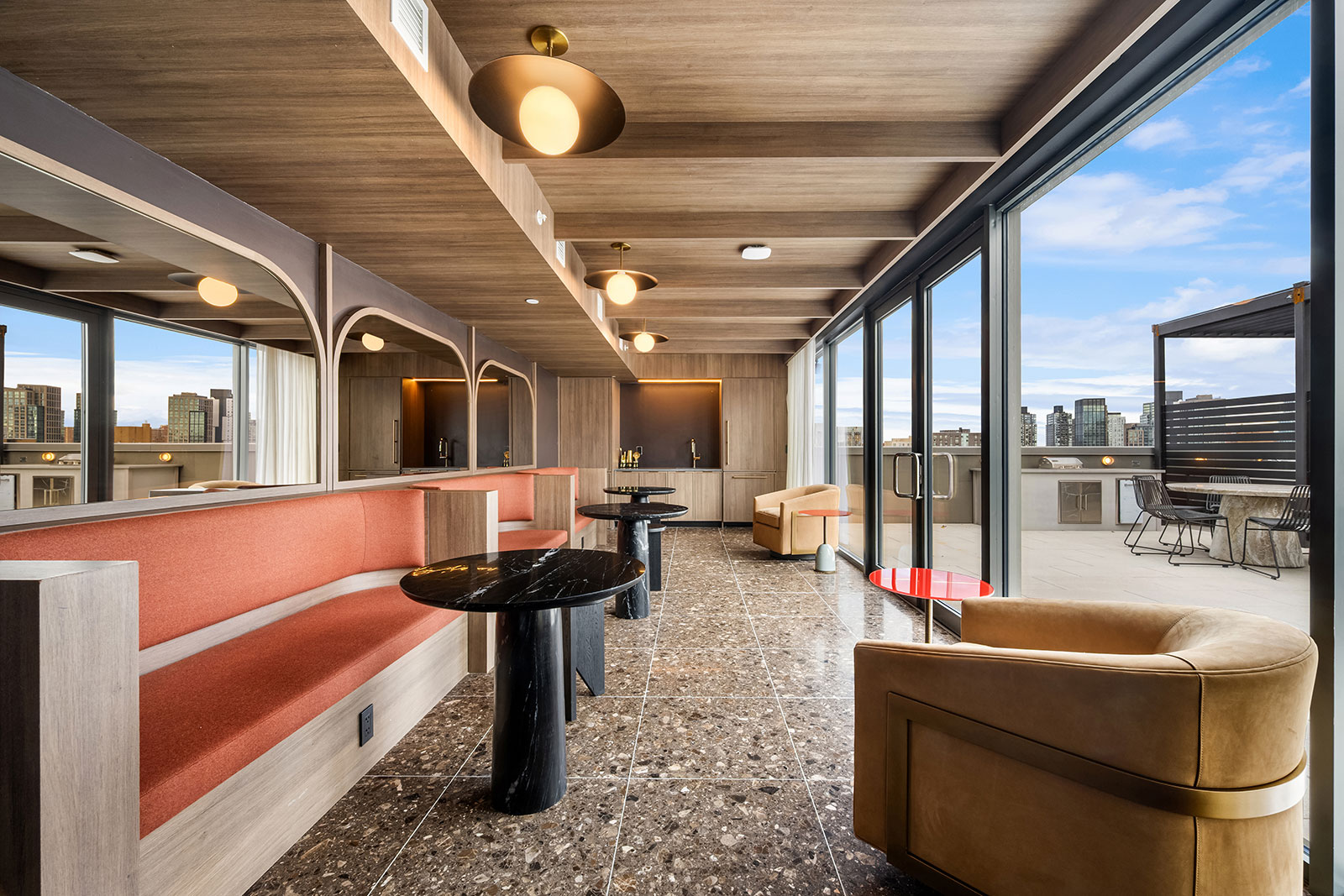 Penthouse lounge with catering-ready reservable lounge and connected to the roof top terrace at 1975 Madison Ave.